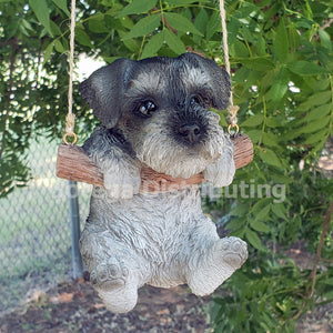 Adorable Schnauzer Pup Hanging on a Branch Swing Playful Puppy Glass Eyes