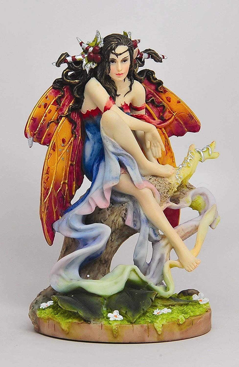 PTC December Glow Winter Winged Fairy Sitting on a Tree Statue Figurine
