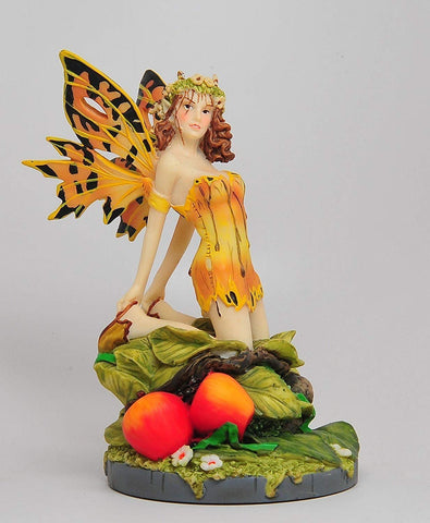 A Salons Gold Color Winged Fairy Sitting on Foliage Statue Figurine